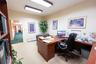 Room featuring neutral wall-to-wall carpeting, textured wall finishes, and overhead rectangular flush-mount lighting
