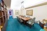 Custom built-in wood cabinetry, integrated recessed lighting, drop ceiling grid, and full-wall mirrors