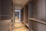 Interior space featuring wood-finish flooring, floor-to-ceiling glass sliding doors, and a tiled private terrace