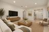 Neutral interior space featuring recessed ceiling lighting, textured wall finish, and a centered window with woven wood shade