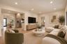 Open-concept living space featuring wood-finish flooring, recessed lighting, and stainless steel kitchen appliances