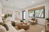 Bright living area featuring recessed lighting, large windows with black frames, and light-toned hard-surface flooring