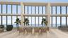 Expansive floor-to-ceiling windows, high-volume ceilings, neutral large-format tile flooring, and integrated structural columns