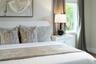 Neutral-toned walls and window featuring natural light