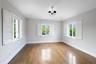 Wood-finish flooring, three windows with interior
