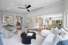 Neutral-toned interior featuring recessed lighting, a brushed-nickel ceiling fan, wood-finish flooring, and recessed linear HVAC diffusers