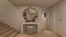 Staircase featuring wood-finish treads and a chevron-patterned accent wall, complemented by light wood-finish wall paneling and recessed ceiling light