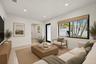 Neutral-toned living space featuring recessed lighting, smooth wall finishes, and polished flooring