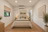 Room featuring wood-finish flooring, a wall-mounted ductless air conditioning unit, recessed ceiling lighting, and a window with a fabric shade