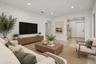 Kitchen featuring flat-panel cabinetry, stainless steel appliances, solid-surface countertops, a single-basin sink with a gooseneck faucet, and terraz