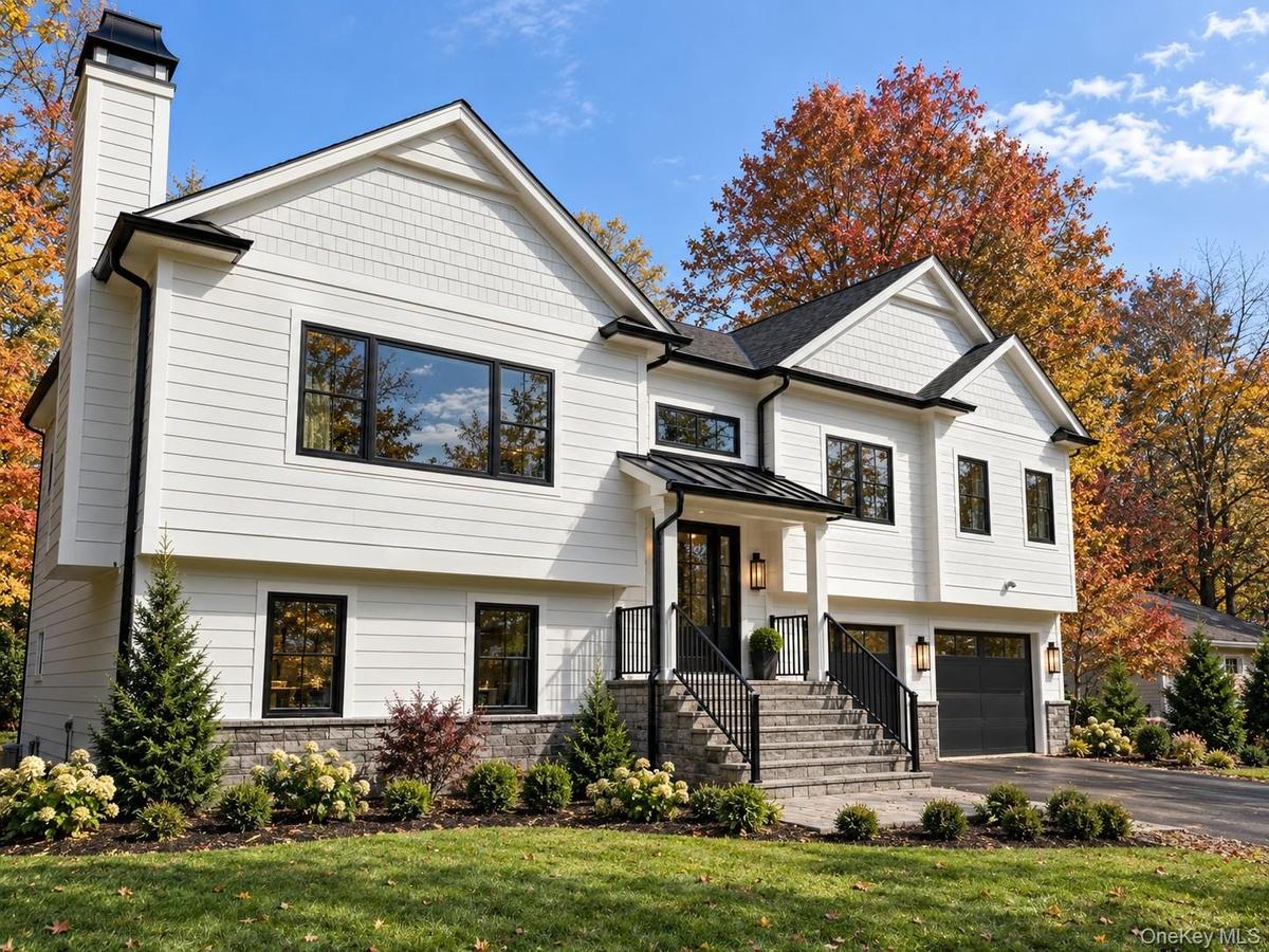 Front Exterior | Digitally Enhanced – Beautifully designed modern farmhouse featuring James Hardie siding, striking black accents, architectural gable