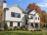 Front Exterior | Digitally Enhanced – Beautifully designed modern farmhouse featuring James Hardie siding, striking black accents, architectural gable