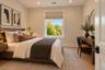 Bedroom 2 | Virtually Staged & Digitally Enhanced – Bright and inviting bedroom featuring beautiful white oak flooring, recessed lighting, and a large