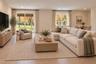 Lower Level Family Room | Virtually Staged & Digitally Enhanced – Beautifully appointed, light-filled family room featuring white oak flooring and an 
