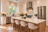 Gourmet Kitchen | Virtually Staged & Digitally Enhanced – Thoughtfully designed with custom cabinetry, exquisite quartz countertops and a full-height 