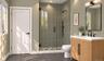 Lower Level Full Bathroom | Virtually Staged & Digitally Enhanced – Beautifully appointed with a glass-enclosed shower featuring floor-to-ceiling tile
