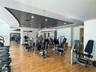 Spacious fitness center featuring wood-finish flooring, recessed lighting, and a variety of exercise equipment