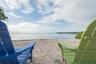 Private waterfront sand beach with mature shoreline vegetation