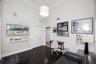 High vaulted ceilings featuring crown molding, dark wood-finish flooring, and a crystal drum chandelier