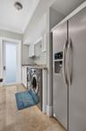 Downstairs laundry with folding area.