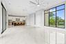 Upstairs Living and Dining Area Leading to the Balcony and Overlooking the Pool