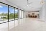Upstairs Living and Dining Area Leading to the Balcony and Overlooking the Pool
