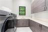 Large Laundry Room with Shelving and Storage