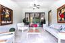 Covered patio featuring stone-tile flooring, a central ceiling fan with integrated lighting, and multi-panel glass-paned French doors