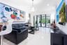 Large-format tile flooring, recessed lighting, crown molding, and floor-to-ceiling glass panel doors with dark frames