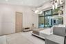 Vaulted ceilings, large-format tile flooring, floor-to-ceiling glass sliding doors, modern circular chandelier, and recessed lighting