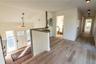 Sunny Foyer with Steps Leading to Large First Floor Landing