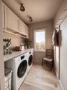 Built-in Custom Cabinetry with Front Loading GE Washer & Dryer
