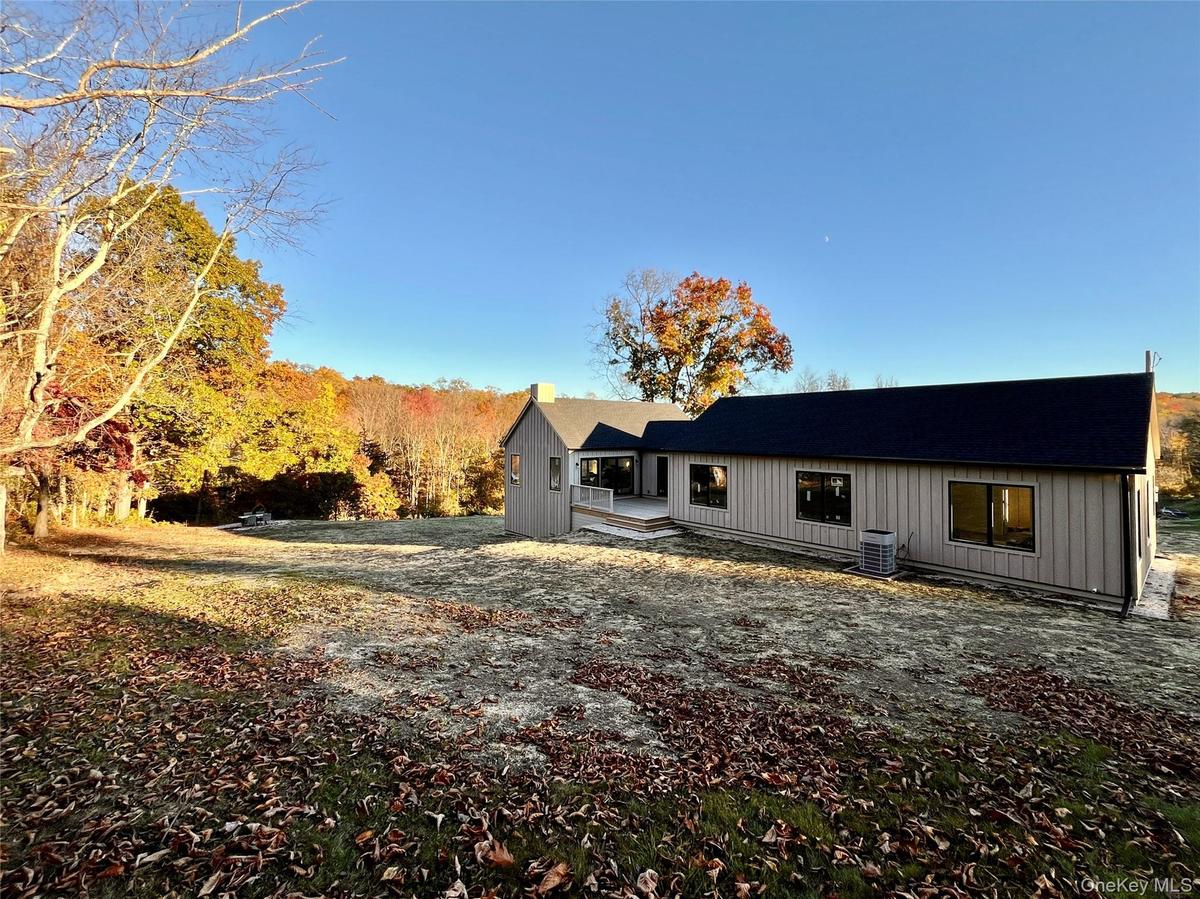 Open Lawns, Meandering Stone Walls, Flowering Bushes & Mature Trees.