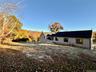 Open Lawns, Meandering Stone Walls, Flowering Bushes & Mature Trees.