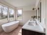 Large Soaking Tub, Terra Cotta Tile Floors & Brass Lighting Fixtures