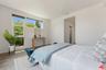 Bedroom featuring wood-style f