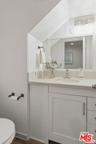 Bathroom featuring a sloped ce