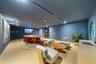 Conference rooom with spacious interior featuring integrated ceiling lighting, recessed air conditioning system, circular window, and neutral wall-to-
