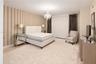 Room featuring vertical-striped accent wall treatment and a decorative multi-arm chandelier