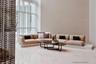 Double-height floor-to-ceiling windows, polished stone flooring, and geometric patterned accent wall