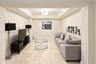 Neutral-toned room featuring a coffered ceiling, recessed lighting, and large-format tile flooring