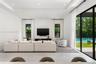 Tray ceiling with recessed lighting, large-format tile flooring, and floor-to-ceiling glass sliding doors opening to an exterior swimming pool and pat
