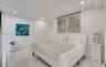 Neutral-toned room featuring large-format stone-finish tile flooring, smooth ceilings with recessed lighting, and white walls
