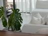 Large-format floor tile, floor-to-ceiling glass sliding doors, and black metal door frames
