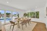 Interior space featuring herringbone-pattern wood-finish flooring, recessed lighting, and wall-mounted ductless air conditioning
