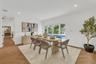 Herringbone-pattern wood-finish flooring, recessed lighting, and multi-panel glass exterior doors