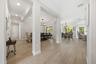 Formal dining open to home yet defined as an elegant space