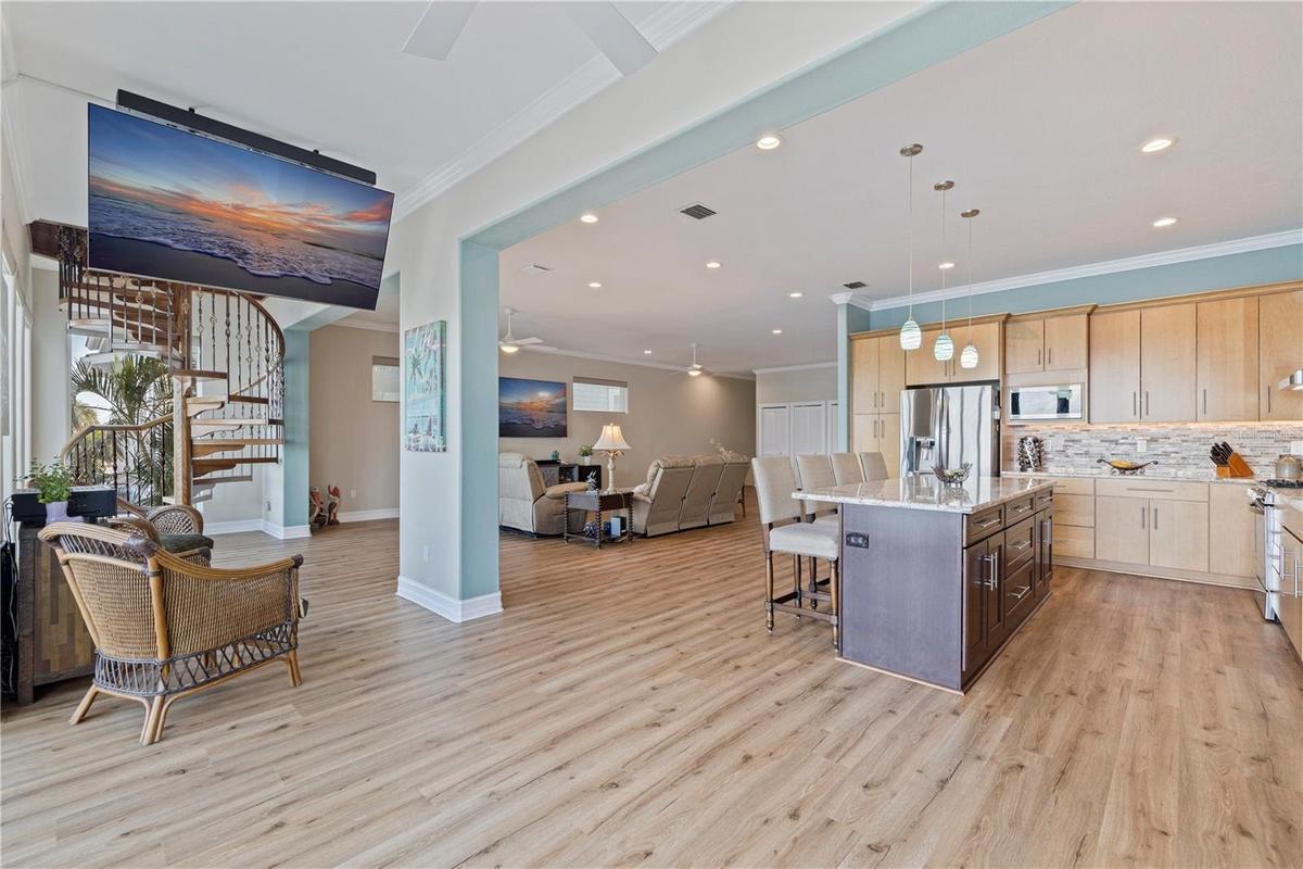 Kitchen/Living/Dining with spiral staircase to 3rd floor