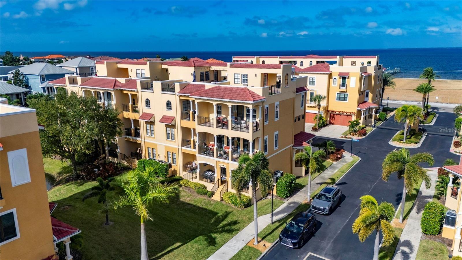 Beautiful End Unit townhome with Breathtaking Water Views sitting in a beautiful Gated Community with Pool!