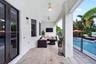 Covered lanai featuring tile flooring, ceiling fans, recessed lighting, and direct access to an in-ground swimming pool